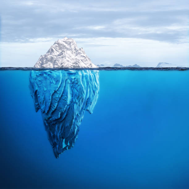 Large iceberg floating in the ocean with its hidden part underwater
