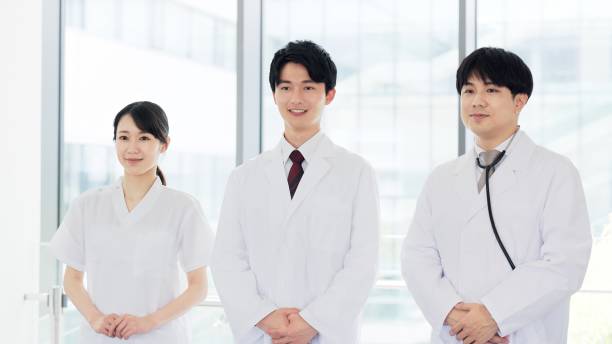 istock Smiling doctor and nurse standing 2190364342