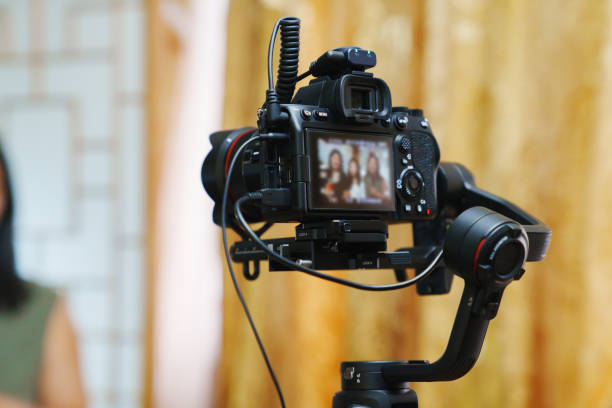 istock A professional camcorder with a blurred image on the screen. 2190364487
