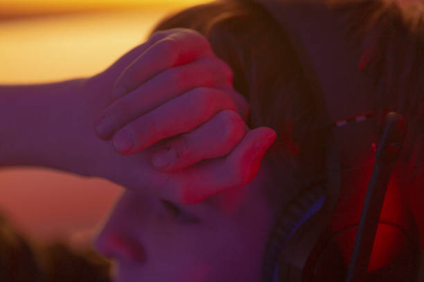 istock A person is gently holding another individuals hand over their face 2190367646