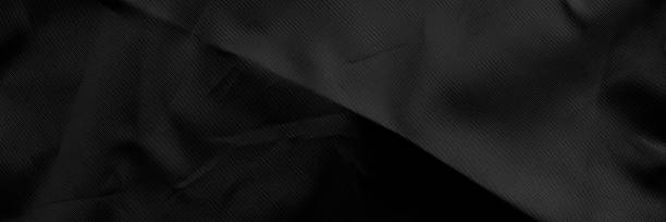 istock Black wrinkled material with wrinkles and contrasting texture 2190368016