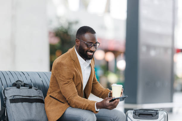 istock Modern professional traveling with luggage and a hot coffee 2190368349