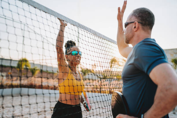 istock Greeting at the end of a beach tennis game 2190370331