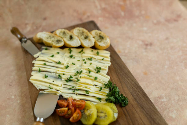 Butter on baguette slices and on board. Copy space