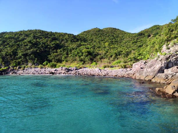 Transparent turquoisec waters at idyllic Hap Mun bay, Sharp island, the largest island in the Kiu Tsui Country Park located at Port Shelter of Sai Kung, Hong Kong. Sharp Island is under the administration of Sai Kung District