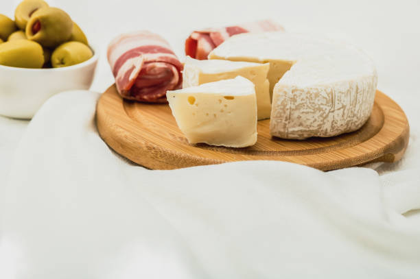 Cheese plate, bacon and olives. Mediterranean food
