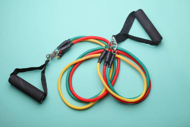istock Rubber expander with handles for fitness on a blue background 2190376926