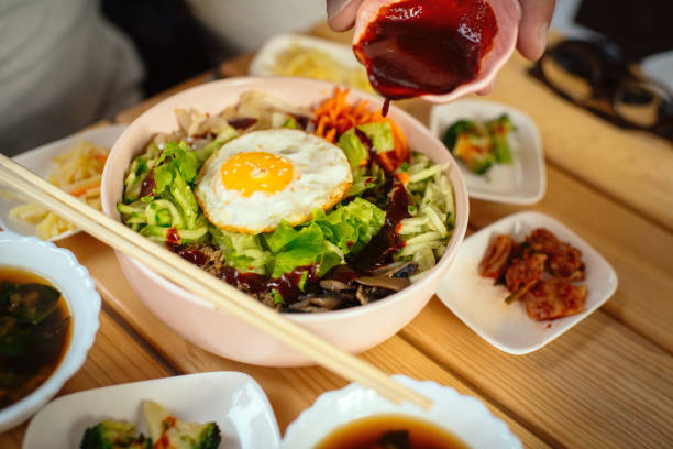 Man eating Bi Bim Bap in a restaurant