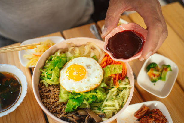 Man eating Bi Bim Bap in a restaurant