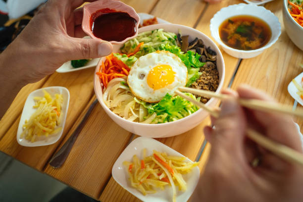 Man eating Bi Bim Bap in a restaurant