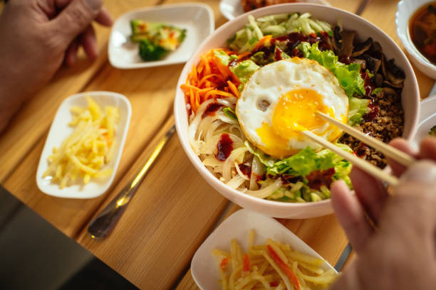 Man eating Bi Bim Bap in a restaurant