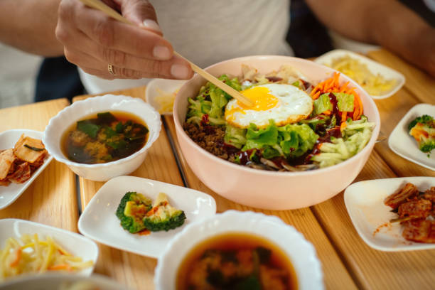 Man eating Bi Bim Bap in a restaurant
