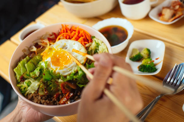 istock Woman eating Bi Bim Bap in a restaurant 2190381754
