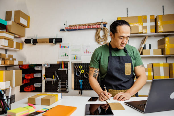 istock Man receives orders for his small business products 2190382989