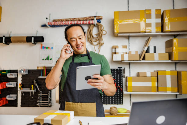 istock Successful man receives orders from customer in his online store 2190383530