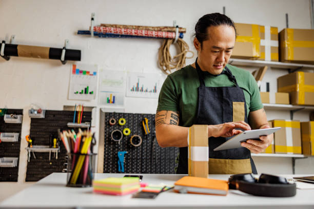 istock A man labeling packages in retail place 2190383608