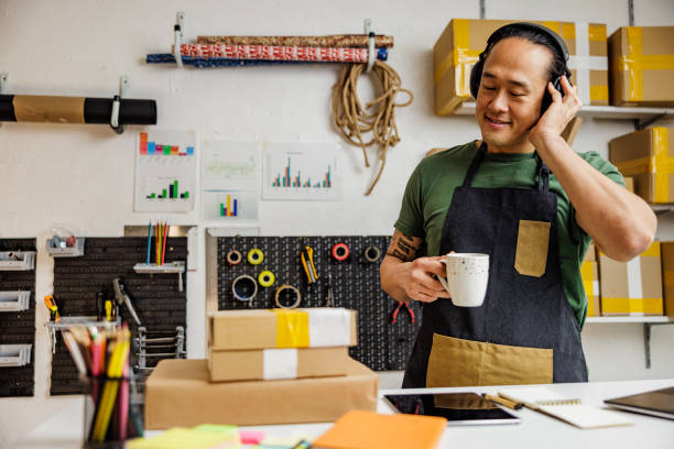 istock Chinese man listening music during coffee break 2190383705