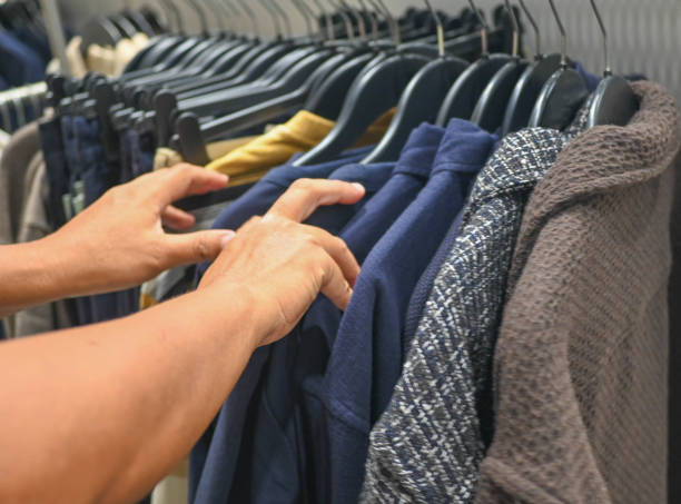istock A person selecting some clothes. stock photo 2190388844