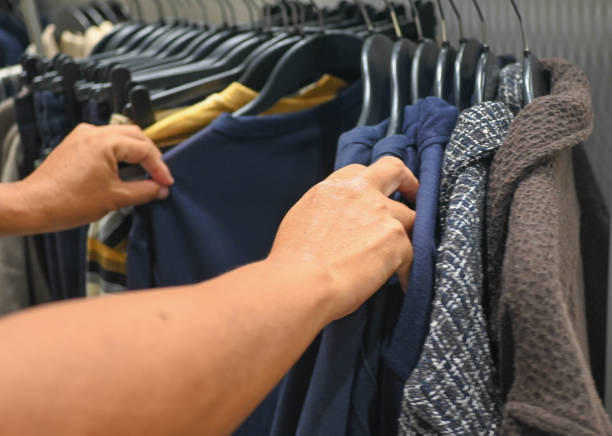 istock A man selecting some clothes. stock photo 2190388869