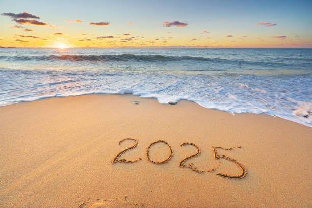 istock 2025 text symbol on the sea sand beach. 2190391478