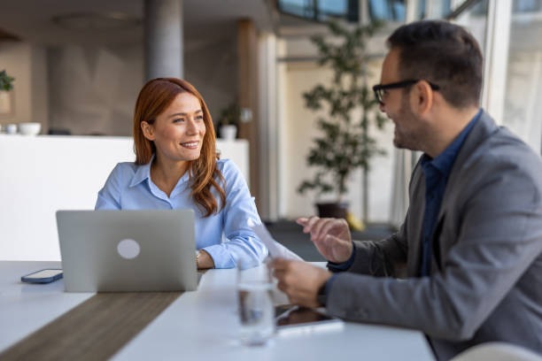 istock Smiling multiracial team discussing ideas in the office 2190392291