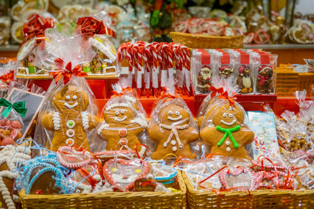 Christmas market stall with gingerbread cookies and candy canes. Concept of festive baking, sweet holiday treats