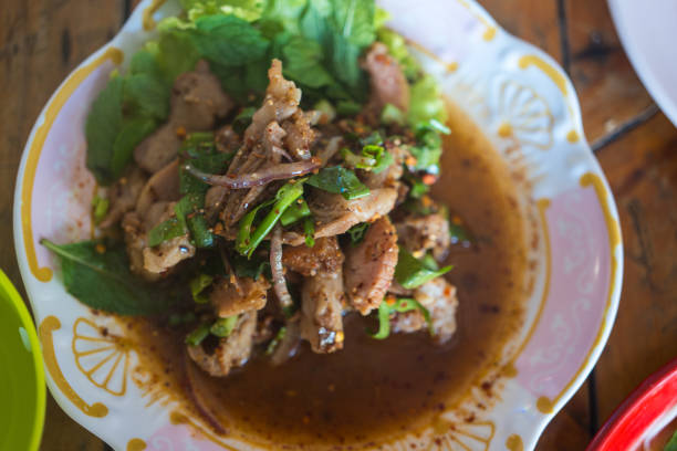 Spicy thai grilled pork salad called Nam Tok Moo.