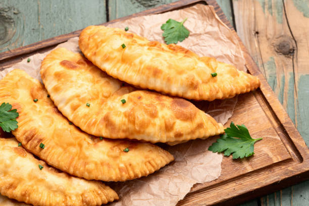 istock Snack chebureks. Pasties with meat photography . Top view 2190396781