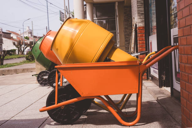 Three cement mixers in a hardware store, showcasing construction tools and building equipment for projects. Perfect for industrial, business, and building site-related themes.