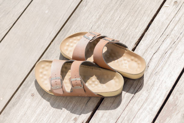 istock Leather sandals wooden floor man 2190397223