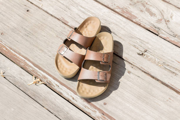 Leather sandals wooden floor man