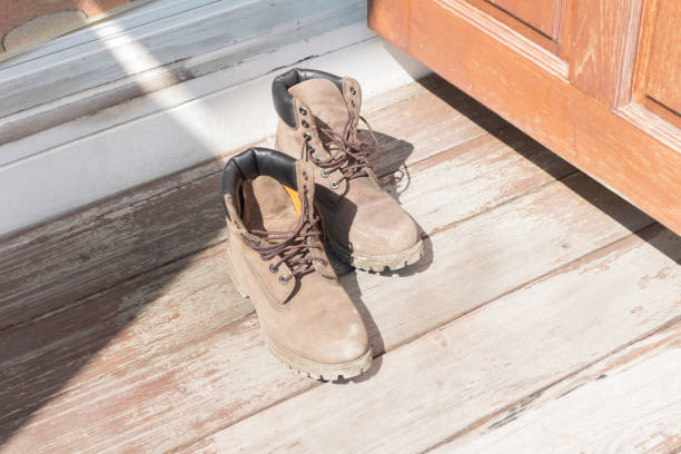 istock Leather boots home floor shoes wood 2190397363