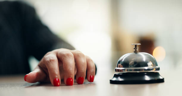 istock Hands, bell and woman at hotel reception with attention for customer support and concierge help. Hospitality, check in and lobby with front desk, service and counter with alert for registration 2190397366