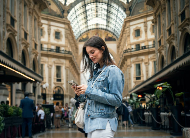 istock Beautiful using mobile while sightseeing on the streets of Milan city 2190400438