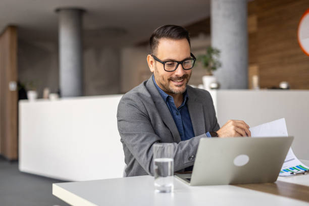 istock Modern businessman at vork, laptop and strategic thinking 2190400983