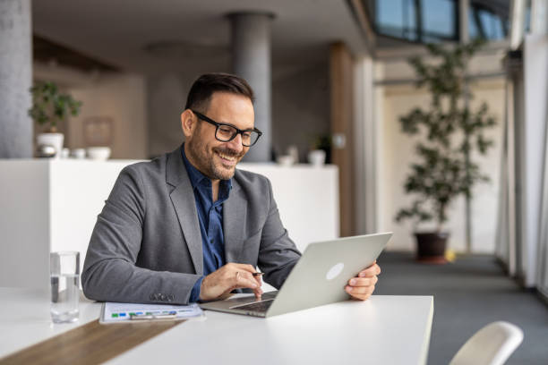 istock Modern businessman at vork, laptop and strategic thinking 2190400998