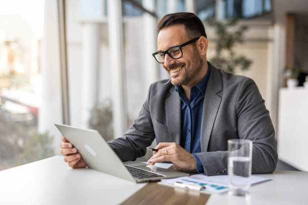 istock Modern businessman at vork, laptop and strategic thinking 2190401039
