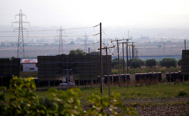 istock High voltage transmission towers and photovoltaics 2190401451
