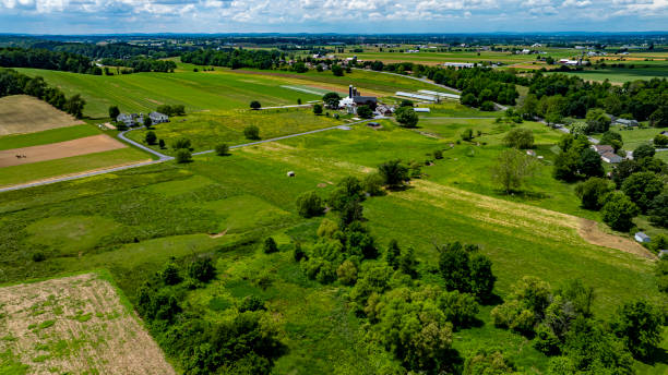 istock Expansive Farmland Under a Blue Sky With Clouds in a Rural Landscape 2190401782