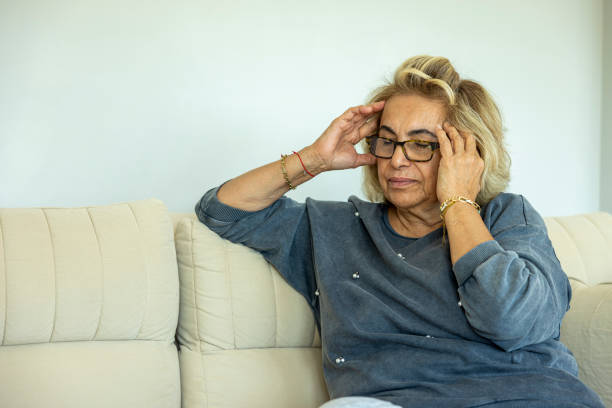 istock A woman suffering from a headache 2190405164