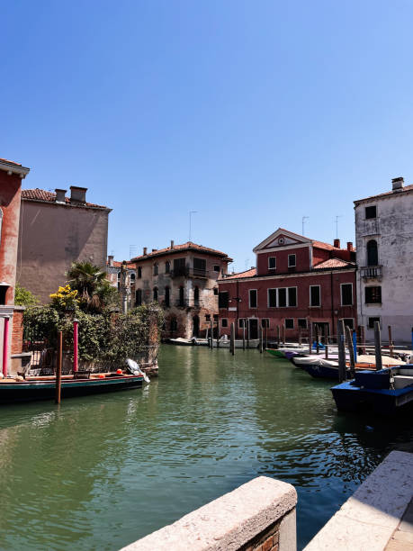 istock Charming canal view with vibrant buildings in Venice, Italy 2190406294