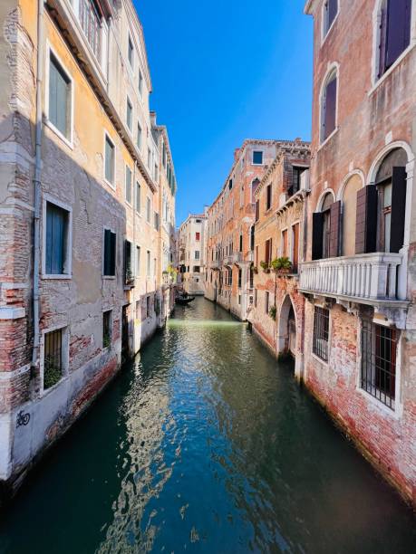 istock Scenic canal view between historic buildings in Venice Italy 2190406309