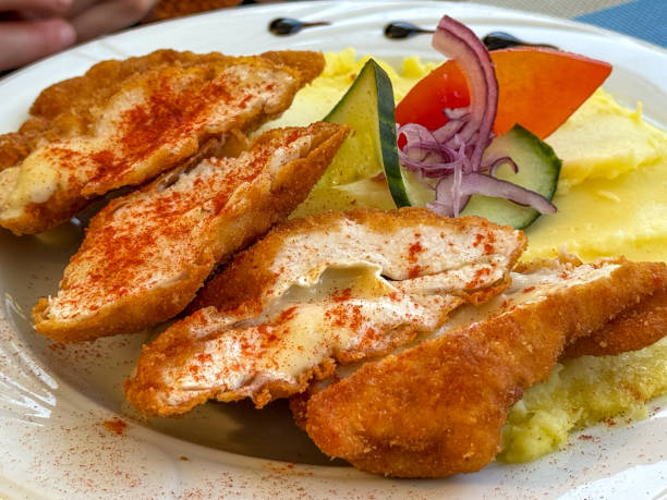 Fried chicken breast stuffed with melted butter.
