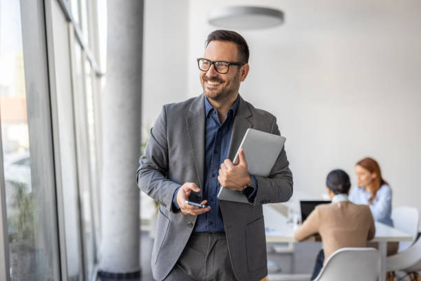 istock Business on the go, professional managing tasks with phone 2190414407
