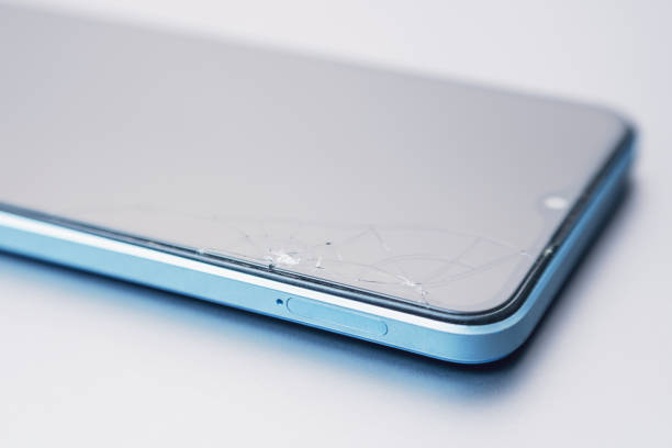 istock Cracks on the screen of a broken phone 2190417120
