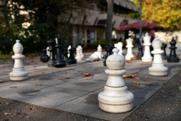 istock Outdoor chess game in a peaceful park setting with large pieces 2190417270
