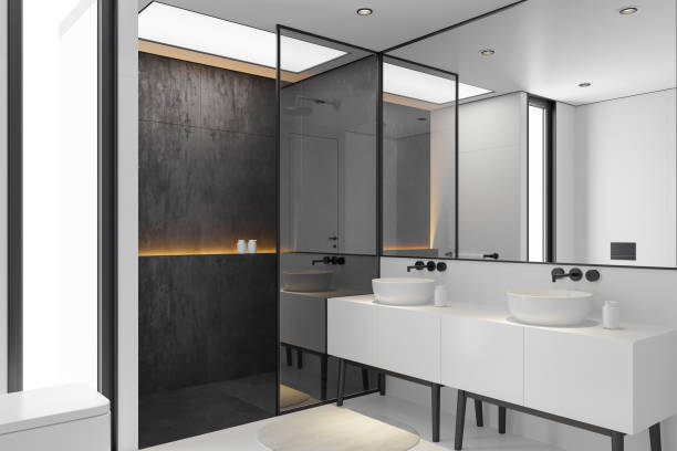 istock Modern Minimalist Black and White Master Bathroom Interior with Double Sinks and Shower with large black marble tiles 2190417473