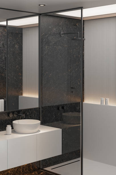 istock Modern Minimalist Black and White Master Bathroom Interior with Double Sinks and Shower with large black marble tiles 2190417474