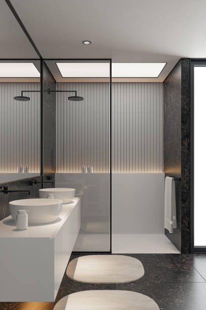 istock Modern Minimalist Black and White Master Bathroom Interior with Double Sinks and Shower with large black marble tiles 2190417682