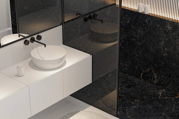 istock Modern Minimalist Black and White Master Bathroom Interior with Double Sinks and Shower with large black marble tiles 2190418082